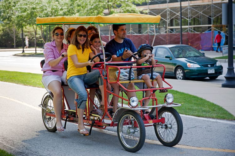 family biking on a quadcycle