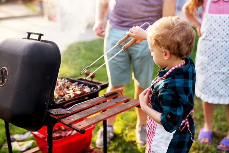 Boy Learning How To Grill Safely