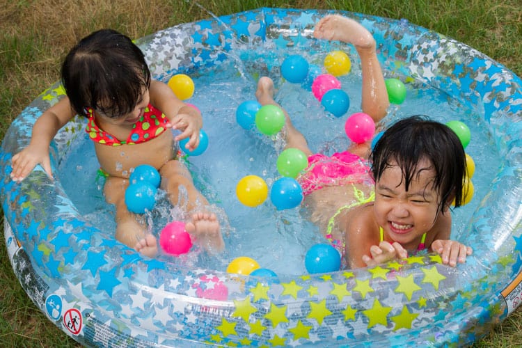 Two Girls In A Kiddie Pool
