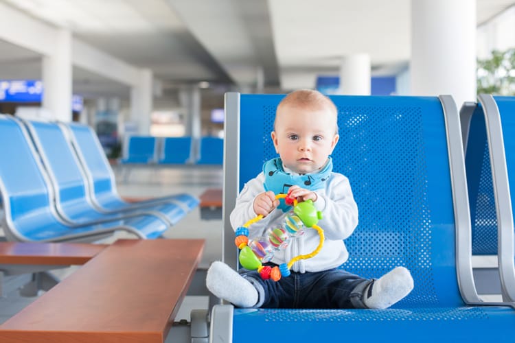 Baby Playing With Toys In Airport