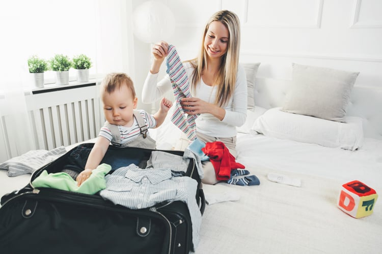 Mom Packing With Her Baby Travel Companion