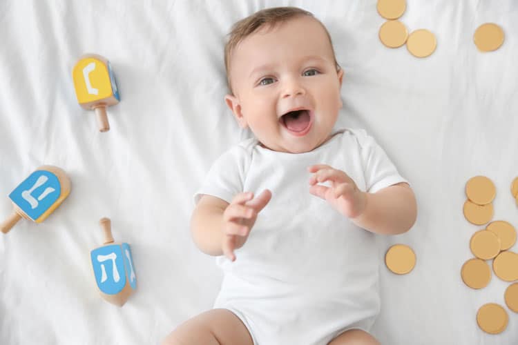 Baby Surrounded By Hanukkah Items