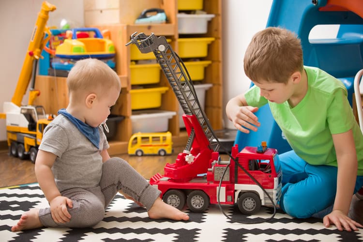 boys playing with miami construction toys