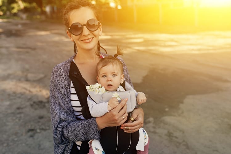 mom with baby in baby carrier in miami