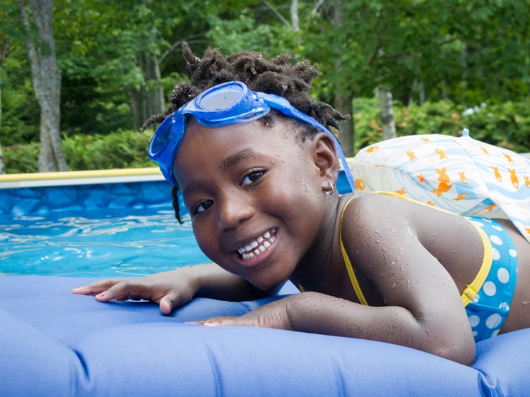 child swimming in miami