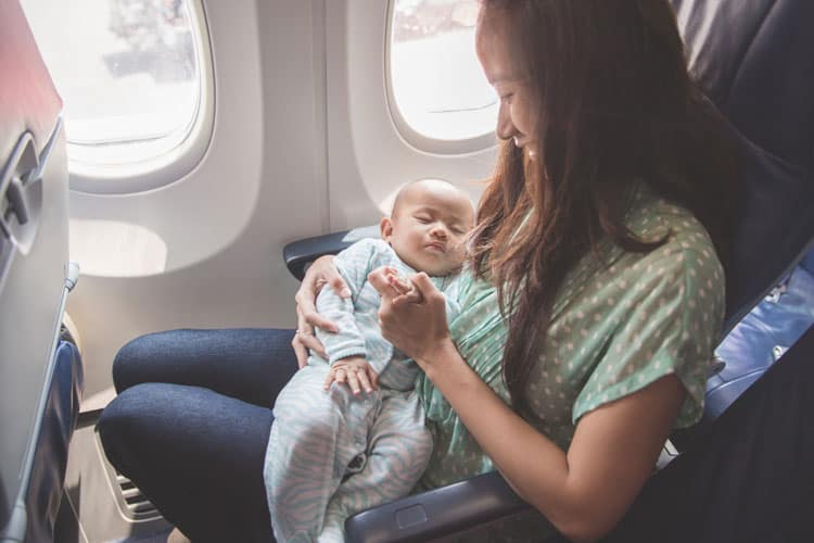 Mother Following Airline Rules For Flying With Infant