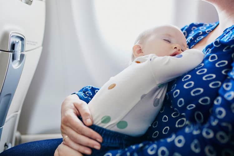 Baby In Mom'S Lap On Airline Following Rules