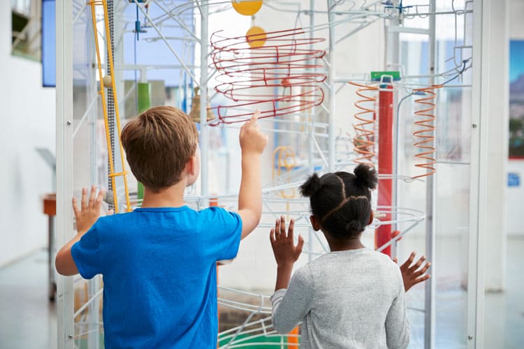 boy and girl enjoying children's museum