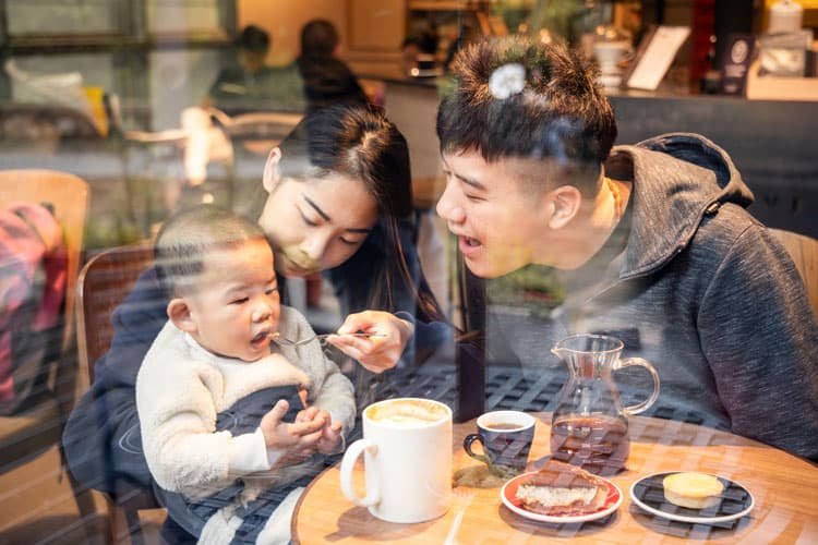Family Eating Pastries At A Coffee Shop