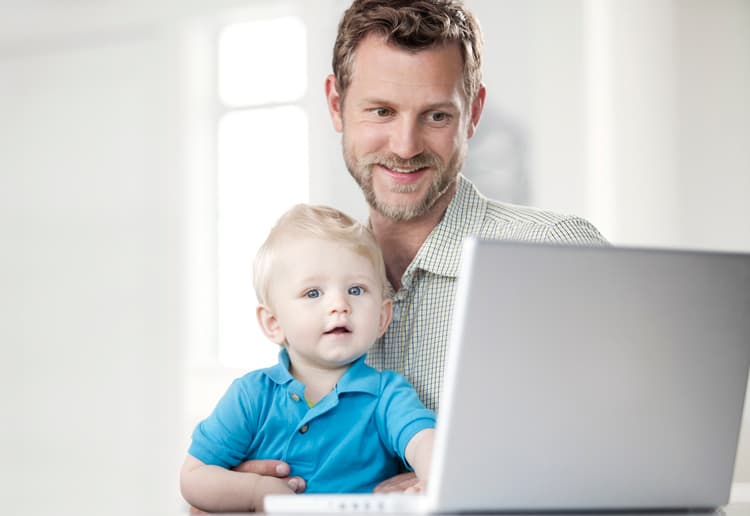 Father Researching Travel With Son
