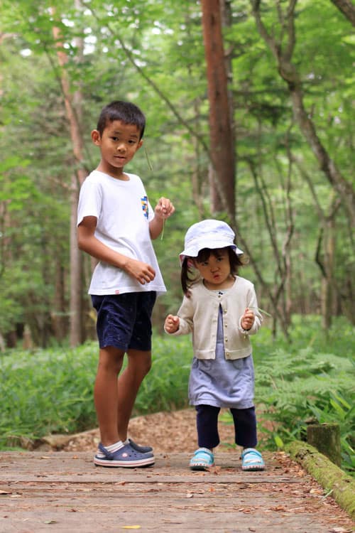 two children backpacking and hiking