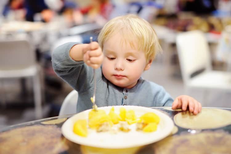 child eating at restaurant in santa fe