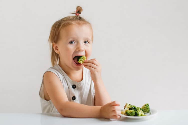 Child Eating Broccoli