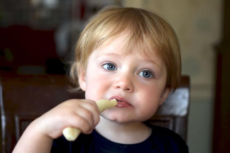 Child Eating String Cheese