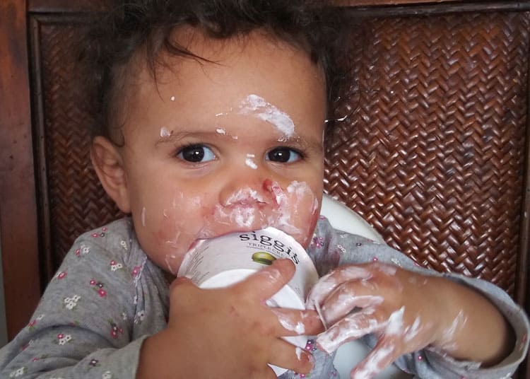 baby eating messy travel snacks