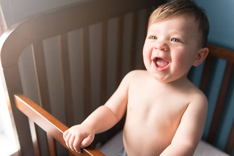 Happy Baby Standing In Crib