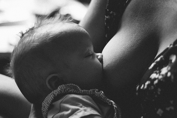 Mother Breastfeeding Baby To Maintain Breast Milk Supply