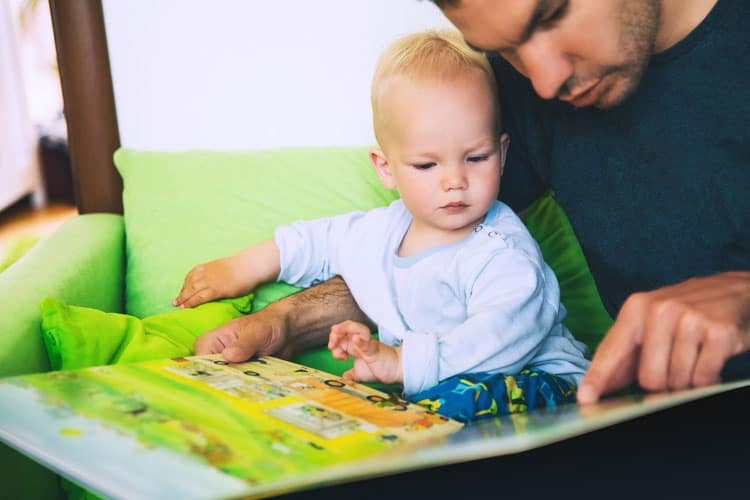 Child Reading With Father