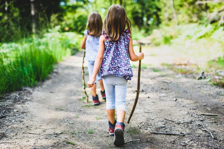 Girls Hiking In Raleigh With Walking Sticks