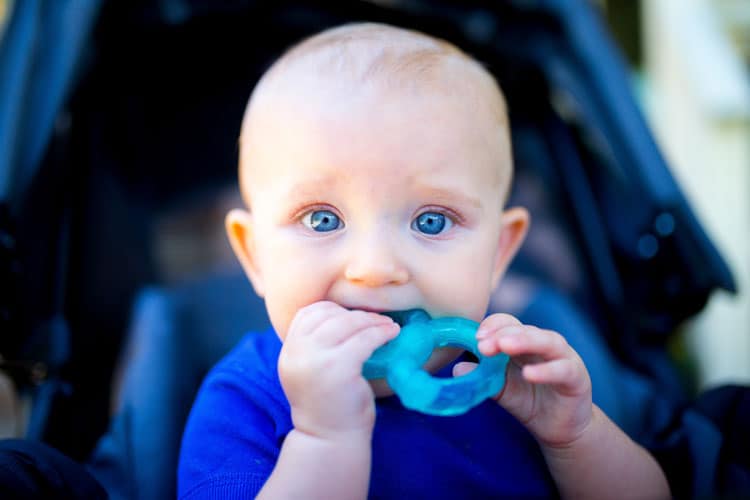 Baby Chewing On Teething Ring