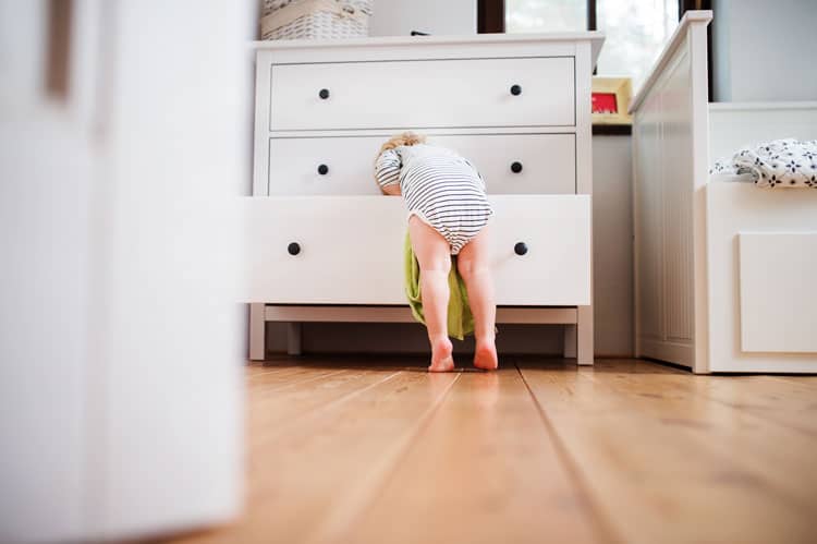 child in dresser drawers