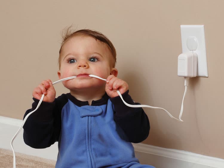 baby chewing on cord