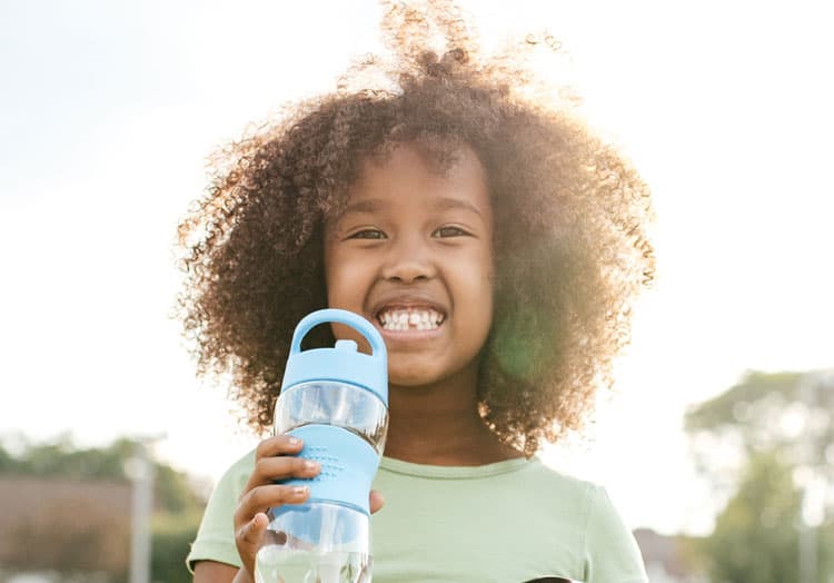 Girl Drinking From Reusable Water Bottle