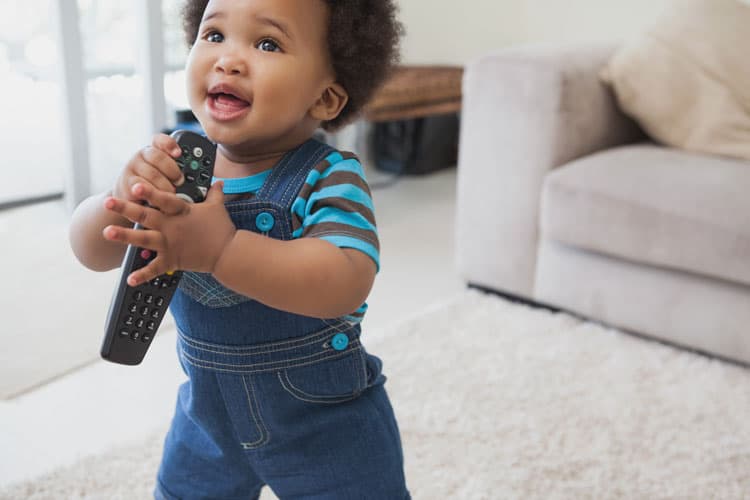 Baby Holding Tv Remote