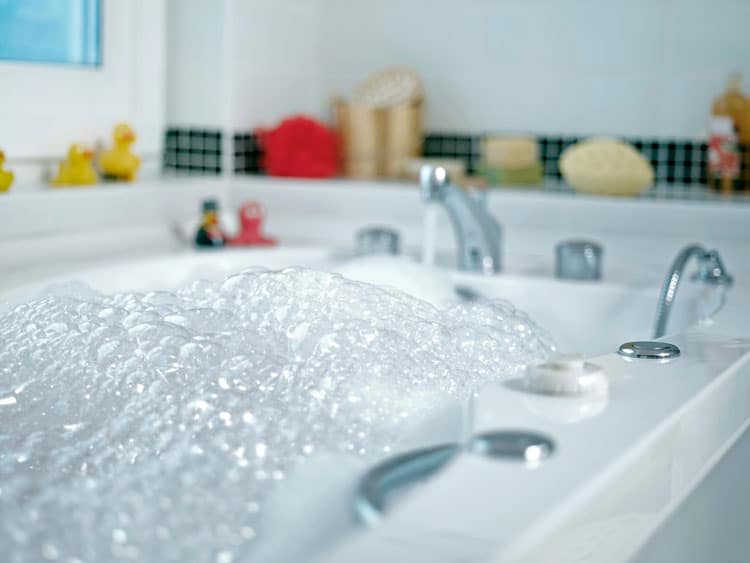 bathtub filled with bubbles