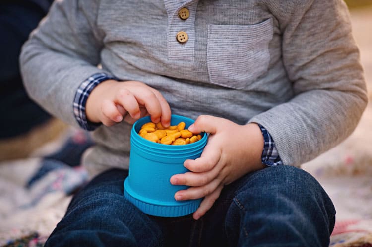 Child Eating Goldfish Shaped Crackers