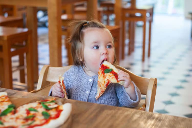 Baby Eating At A Restaurant
