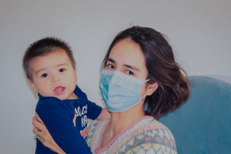 Mother Wearing Mask With Son