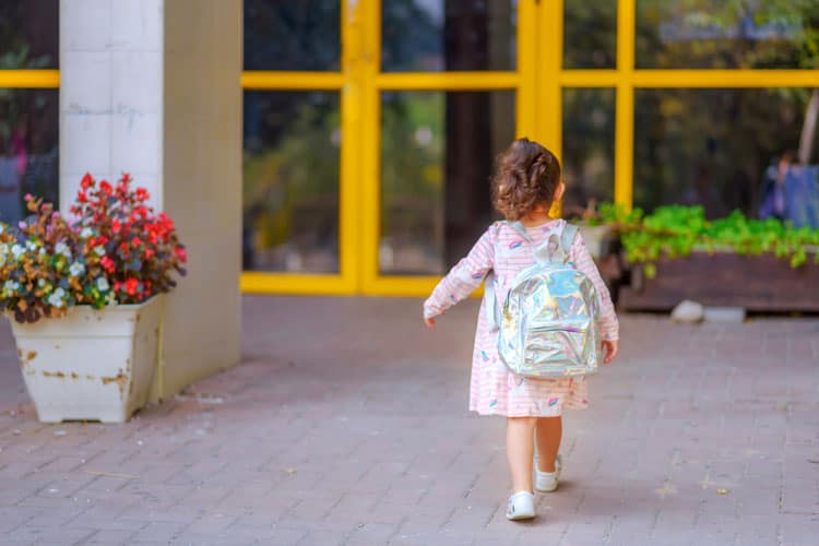 Small Girl Walking Into School