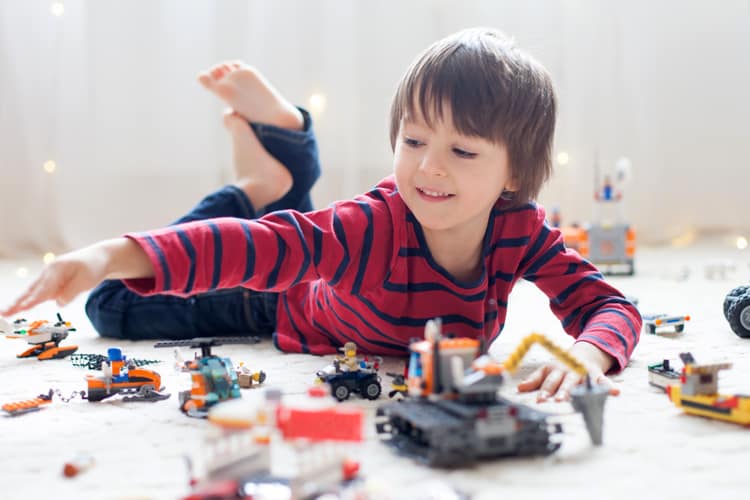 Child Playing With Legos