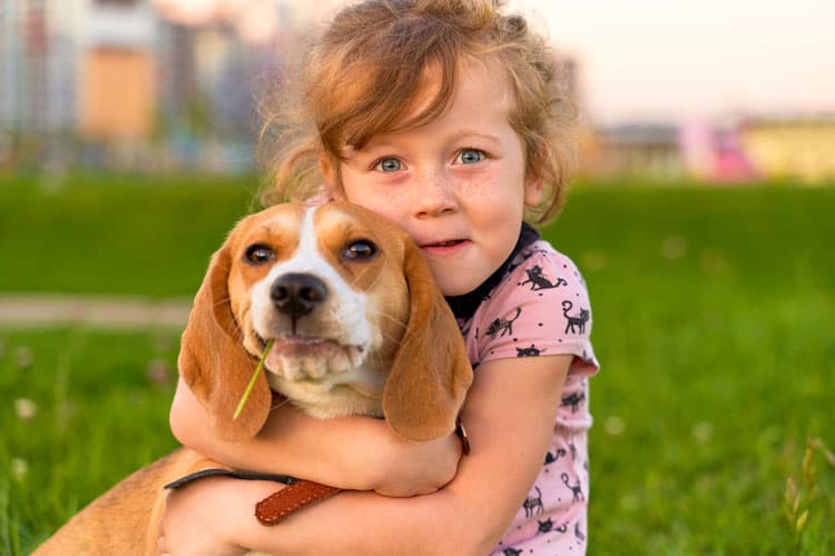 Girl Hugging Her Dog 