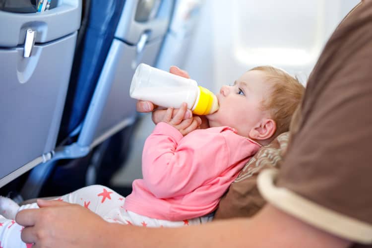 Baby Drinking Bottle On Airplane