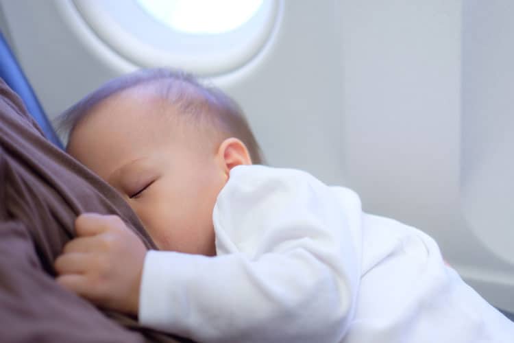 Baby Nursing In An Airplane