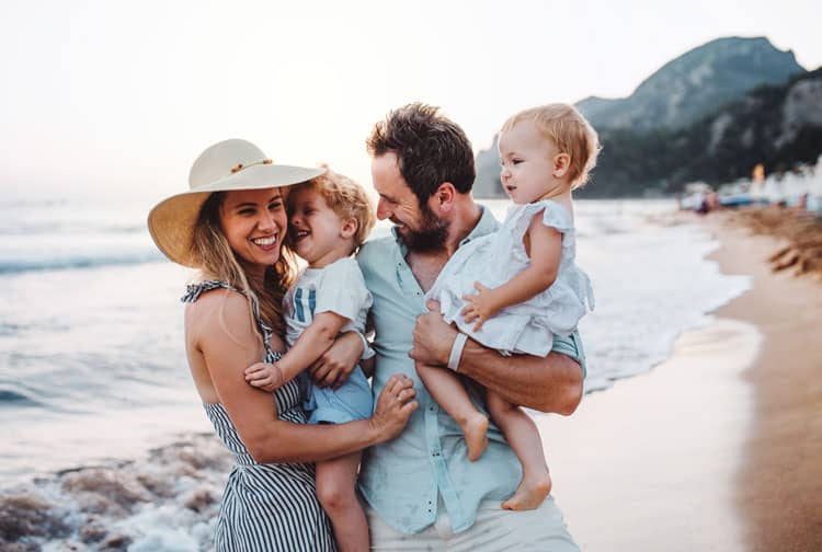 Travel Is Back - Happy Family On The Beach